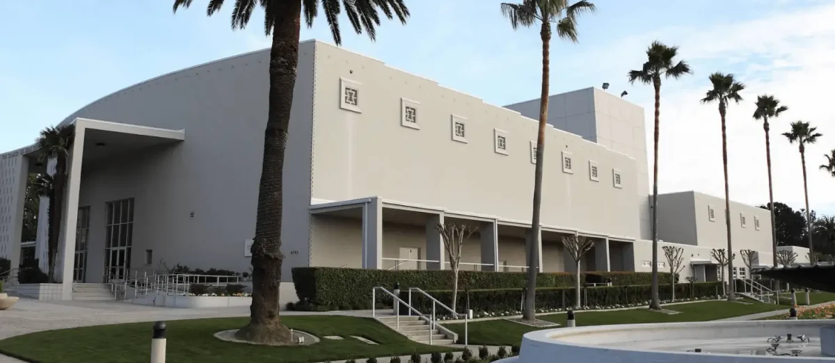 The Oakland Temple Hill Interstake Center is seen a couple of palm trees at Temple Hill.
